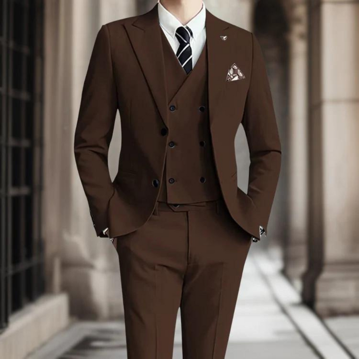 Patrik's elegant three-piece suit provides a sophisticated look